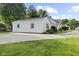 Charming home exterior with lush green lawn and a spacious concrete driveway at 170 W Broadway St, Greenwood, IN 46142