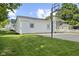 Side view of garage and yard with a basketball hoop, adding recreational appeal at 170 W Broadway St, Greenwood, IN 46142