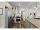 Updated kitchen boasts stainless steel appliances, custom cabinetry, and spacious layout at 170 W Broadway St, Greenwood, IN 46142