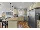 Bright kitchen showcases granite counters, stainless appliances, and custom cabinets at 170 W Broadway St, Greenwood, IN 46142