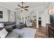Open-concept living room with views of the kitchen, dining area, and hardwood floors at 170 W Broadway St, Greenwood, IN 46142