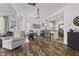Open floor plan combining living, dining, and kitchen areas with hardwood floors at 170 W Broadway St, Greenwood, IN 46142