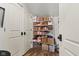 Walk-in pantry with plenty of shelving and storage for groceries and kitchen items at 170 W Broadway St, Greenwood, IN 46142