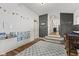 Playroom with decorative wall hangings and access to stairway and other rooms at 170 W Broadway St, Greenwood, IN 46142