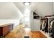 Bright finished attic features hardwood floors, custom closets, and open design at 1725 W 53Rd St, Indianapolis, IN 46228