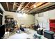 Unfinished basement space with exercise equipment and storage at 1725 W 53Rd St, Indianapolis, IN 46228
