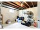 Unfinished basement area with storage and exposed ceiling beams at 1725 W 53Rd St, Indianapolis, IN 46228