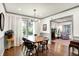 Bright dining room features a modern light fixture and hardwood floors at 1725 W 53Rd St, Indianapolis, IN 46228