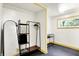 Bright dressing area with wardrobe, shelving, full-length mirror and window at 1725 W 53Rd St, Indianapolis, IN 46228