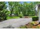 Large driveway with ample parking space, surrounded by beautiful landscaping and greenery at 1725 W 53Rd St, Indianapolis, IN 46228