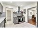 Modern kitchen showcasing stainless steel appliances, light gray cabinets, and ceramic tile flooring at 1725 W 53Rd St, Indianapolis, IN 46228