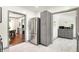 An open-concept kitchen shows stainless steel refrigerator, tile floors, and light gray cabinets at 1725 W 53Rd St, Indianapolis, IN 46228