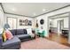 Cozy living room with a couch, colorful decor, and an open floor plan at 1725 W 53Rd St, Indianapolis, IN 46228