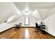 Attic office space with hard wood floors and white paint, perfect for working at home at 1725 W 53Rd St, Indianapolis, IN 46228