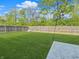 Fenced backyard featuring grass and mature trees at 1843 Winchester Blvd, Avon, IN 46123