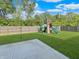 Fenced backyard featuring grass and playground at 1843 Winchester Blvd, Avon, IN 46123