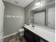 Bathroom featuring single sink vanity, and bath tub with shower at 1843 Winchester Blvd, Avon, IN 46123