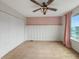 Bedroom featuring closet and window with pink curtain and fan at 1843 Winchester Blvd, Avon, IN 46123