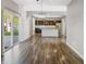 Open-concept living space featuring a modern kitchen and hardwood floors at 1843 Winchester Blvd, Avon, IN 46123