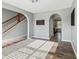 Spacious living room featuring hardwood floors, neutral paint, and arched doorways at 1843 Winchester Blvd, Avon, IN 46123