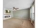 Bright living room featuring a modern fireplace, ceiling fan, and neutral paint at 1843 Winchester Blvd, Avon, IN 46123