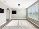 Bright living room with large window, neutral paint, and hardwood flooring at 1843 Winchester Blvd, Avon, IN 46123