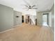 Open loft area featuring neutral paint, ceiling fan and an open railing overlooking the stairs at 1843 Winchester Blvd, Avon, IN 46123