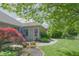 Picturesque backyard featuring a charming patio, beautiful landscaping, and mature trees, creating a serene outdoor oasis at 1858 Broadleaf Ct, Greenwood, IN 46143