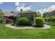 Spacious backyard featuring lush lawn, mature trees, landscaped gardens, and a cozy patio area for outdoor enjoyment at 1858 Broadleaf Ct, Greenwood, IN 46143