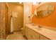 Bathroom features a white vanity, decorative mirror and unique tiled walls for a modern touch at 1858 Broadleaf Ct, Greenwood, IN 46143
