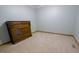 Bedroom features neutral paint, wall trim, light tan carpeting and custom wooden built-in cabinet at 1858 Broadleaf Ct, Greenwood, IN 46143