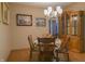 This formal dining room features wood floors, a chandelier, and a china cabinet for elegant dinners at 1858 Broadleaf Ct, Greenwood, IN 46143
