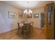 Dining room features hardwood floors, a chandelier, a table with chairs and a built-in cabinet at 1858 Broadleaf Ct, Greenwood, IN 46143