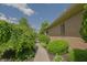 Charming brick home with lush landscaping and a winding walkway, showcasing the well-maintained exterior at 1858 Broadleaf Ct, Greenwood, IN 46143