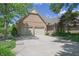 Charming brick home featuring a well-manicured lawn and a convenient two-car garage at 1858 Broadleaf Ct, Greenwood, IN 46143