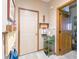 Bright hallway with tile flooring, coat storage, and doorways leading to other rooms at 1858 Broadleaf Ct, Greenwood, IN 46143