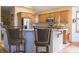 Charming kitchen with bar seating, stainless appliances, decorative elements, and abundant cabinetry at 1858 Broadleaf Ct, Greenwood, IN 46143