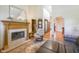 Inviting living room with a fireplace, comfortable seating, a decorative rug, and wood flooring at 1858 Broadleaf Ct, Greenwood, IN 46143
