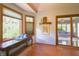 Sitting area with natural light, hardwood floors, a view of the backyard, and access to the sunroom at 1858 Broadleaf Ct, Greenwood, IN 46143