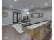 Finished basement boasts a game room with a shuffleboard and dining area at 187 N Bend Dr, Greenwood, IN 46142