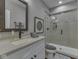 Bathroom features a vanity with a mirror and a walk-in shower with glass doors at 187 N Bend Dr, Greenwood, IN 46142