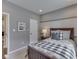 Cozy bedroom with neutral paint, striped blanket, and lots of natural light at 187 N Bend Dr, Greenwood, IN 46142