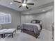 Comfortable bedroom with a neutral color palette, large window, ceiling fan, and soft carpet at 187 N Bend Dr, Greenwood, IN 46142