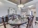 Elegant dining room featuring stylish lighting, dark wood floors, and a decorative sideboard at 187 N Bend Dr, Greenwood, IN 46142