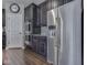 Modern kitchen with stainless steel appliances, dark cabinets, and stylish backsplash at 187 N Bend Dr, Greenwood, IN 46142