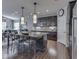 Well-lit kitchen with dark cabinets, stainless steel appliances, and a view into the adjacent dining area at 187 N Bend Dr, Greenwood, IN 46142