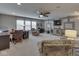 Spacious living room featuring a large flat screen TV, modern furniture, and lots of natural light at 187 N Bend Dr, Greenwood, IN 46142