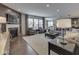 Bright living room with a fireplace, wood floors, large windows, and comfortable seating at 187 N Bend Dr, Greenwood, IN 46142