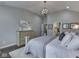 Bright main bedroom offering a view of the ensuite bathroom, soft lighting, and a comfortable aesthetic at 187 N Bend Dr, Greenwood, IN 46142