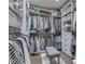 A spacious walk-in closet with ample shelving, drawers, hanging space, and a seating bench at 187 N Bend Dr, Greenwood, IN 46142